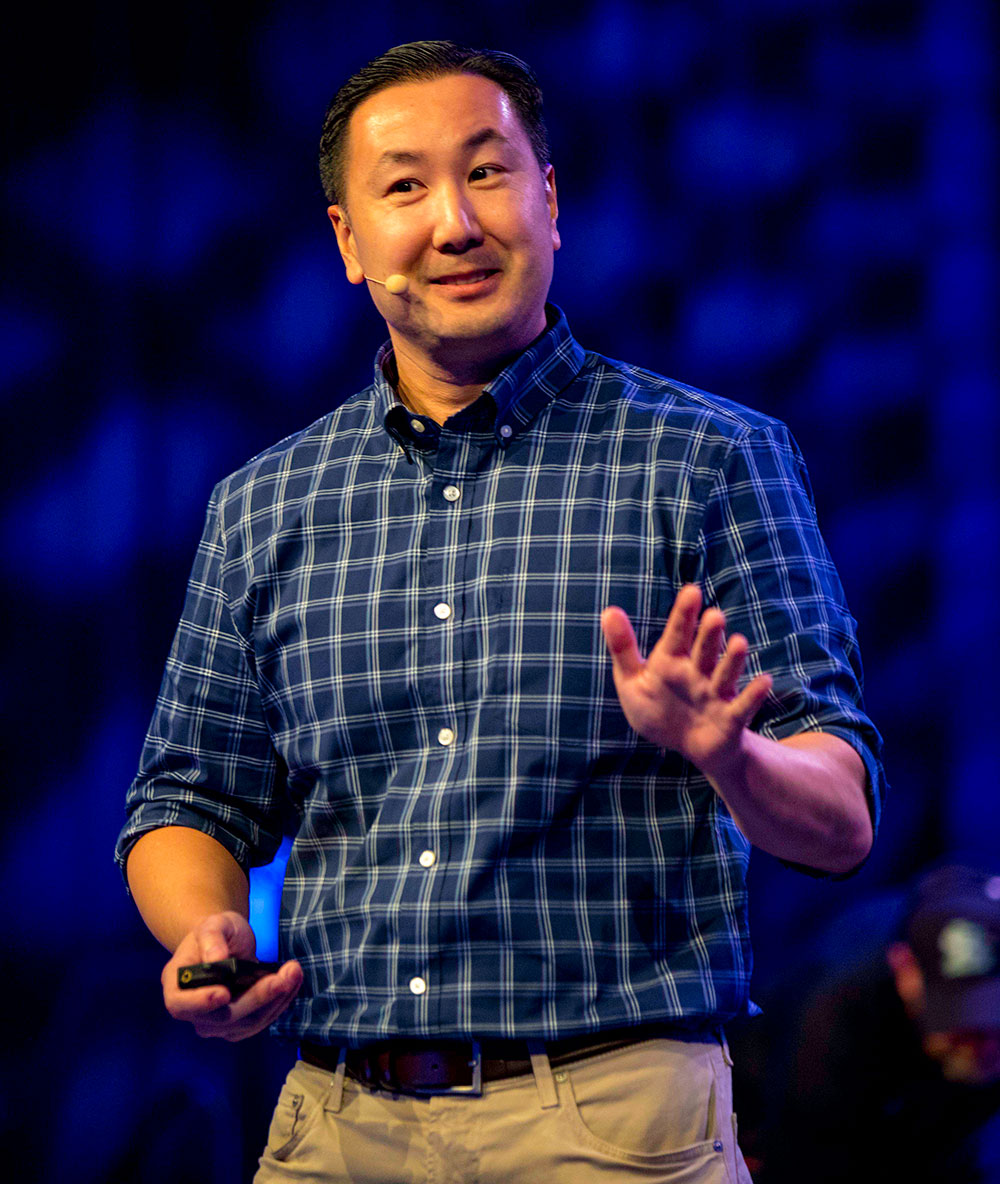 Steve Chou speaking on stage at Sellers Summit