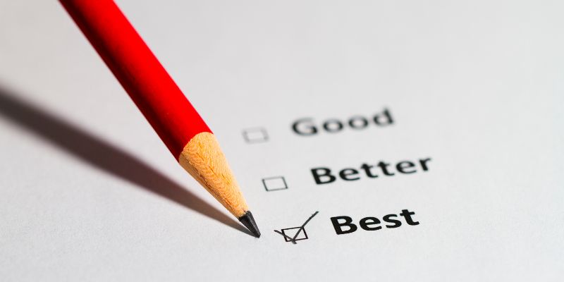 Pencil placing a checkmark beside the word best