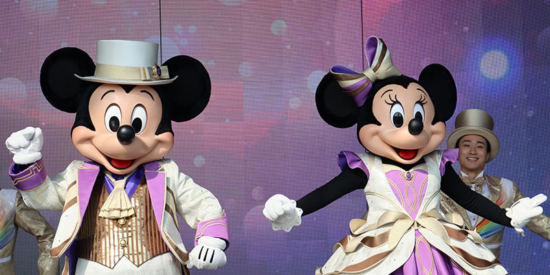 Mickey mouse and Minnie mouse performing on a stage