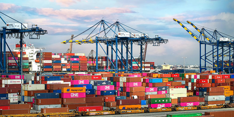 Ships being loaded with shipping containers at Port of Los Angeles USA