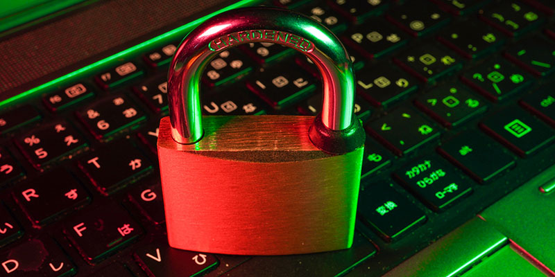 A padlock sitting on top of a computer keyboard