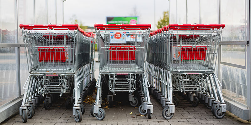 Lined gray and red shopping carts