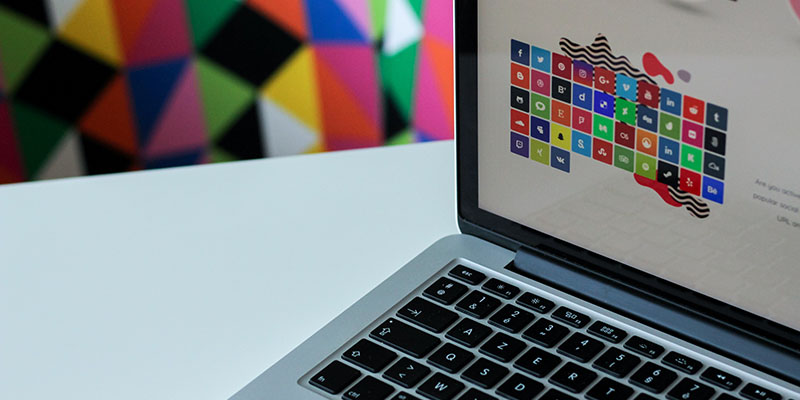 Silver laptop with assorted logos