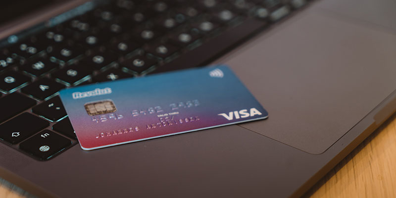 Visa card on a grey laptop