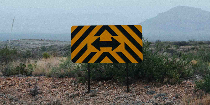 Arrow sign on a desert road