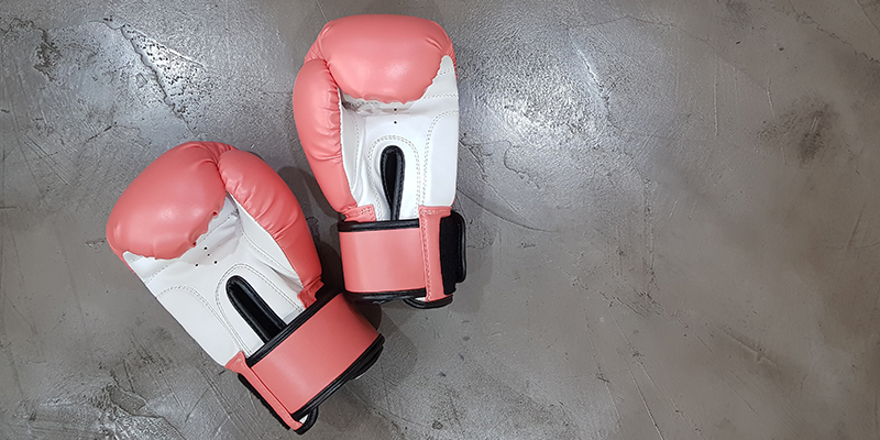Red and white pair of boxing gloves