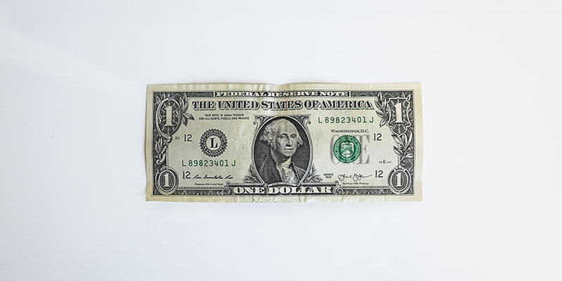 One dollar bill on a White background