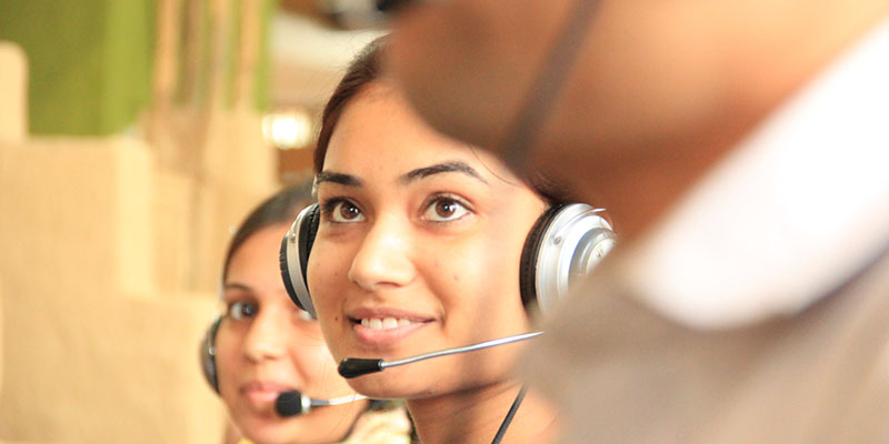 A smiling phone answering service provider