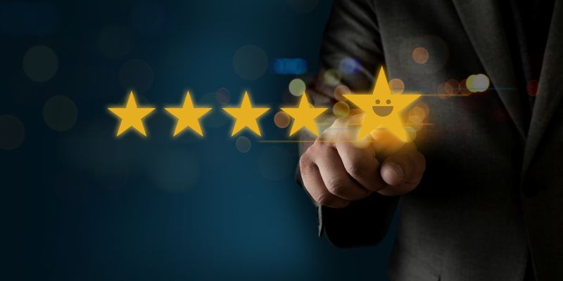 hand pointing to five stars indicating a five star review