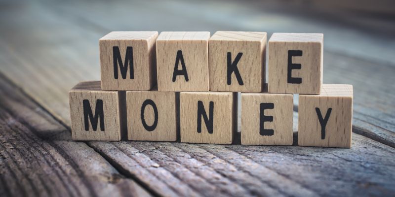 blocks on a table spelling the words make money