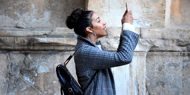 A young woman taking a photo