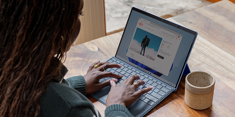 Woman typing on her laptop