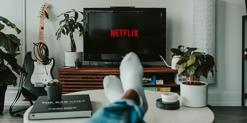 A man watching Netflix in his drawing room