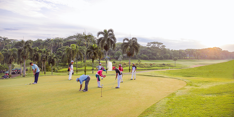 People playing at a gold course