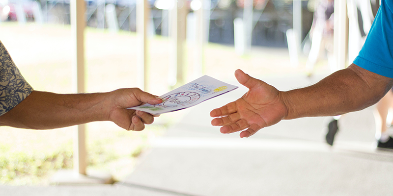 A salesperson distributing flyers