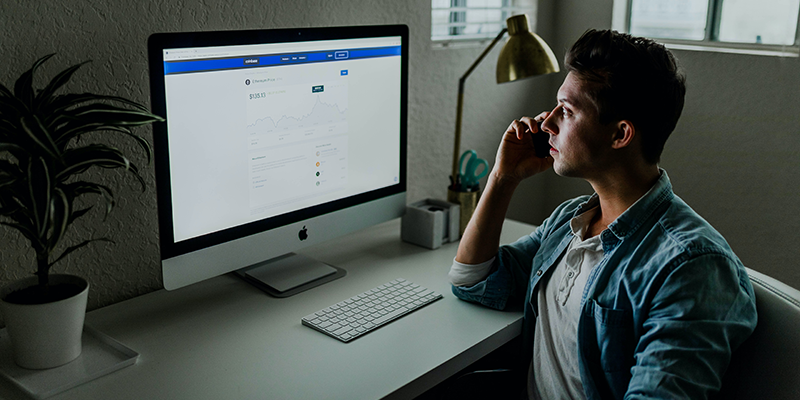 A teen working on his computer