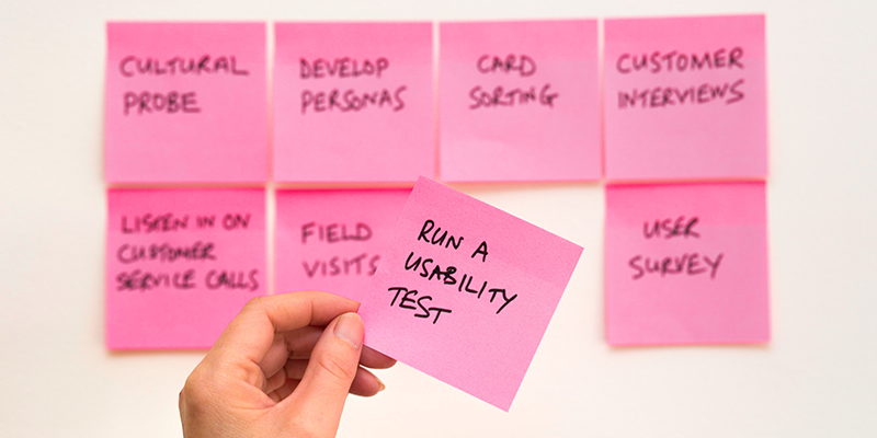 Run a usability test written on a pink post it