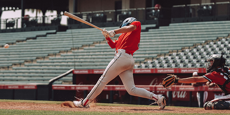 A pro baseball player swinging his bat